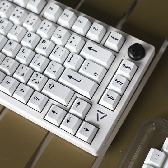 minimal white keycaps on a white keyboard right angle